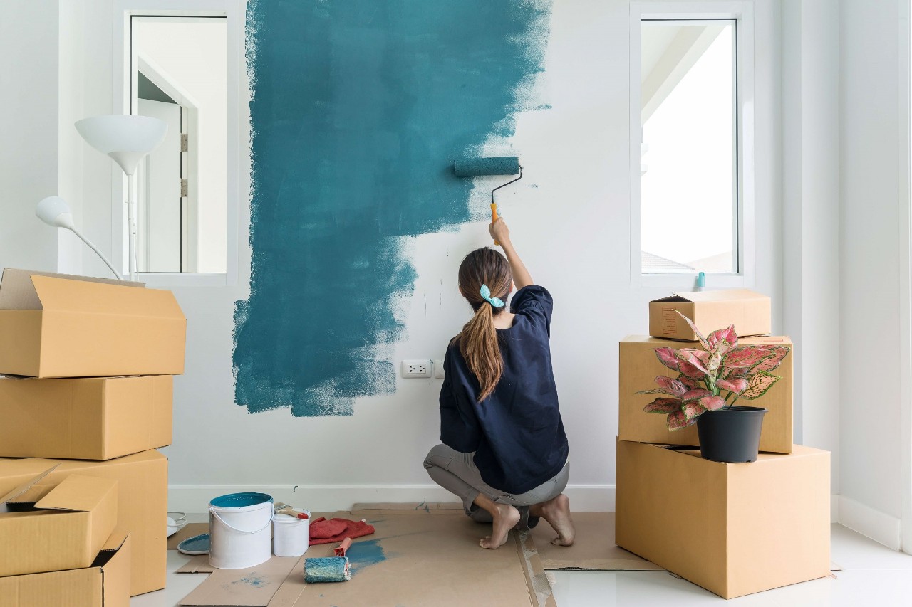 young lady painting her new home