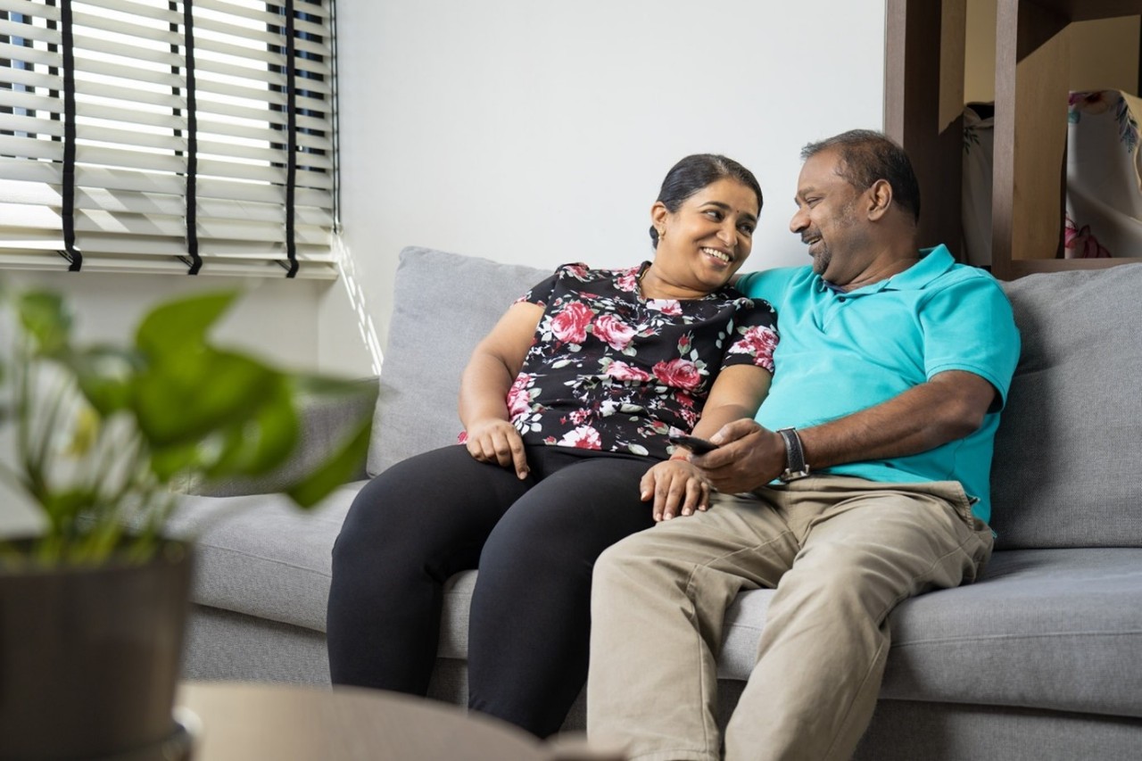 An elderly couple enjoying their time together at home.